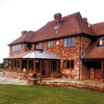 Brown conservatory with brick base