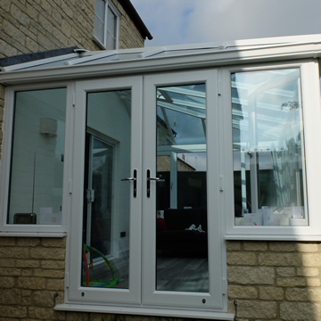 White french doors on a conservatory