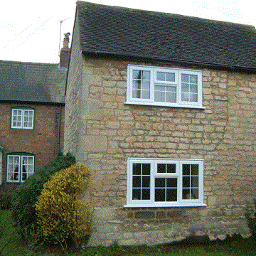 Georgian windows with astragal bars in Cotswold stone house