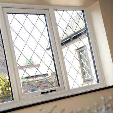 White uPVC windows with lead detail for a traditional look