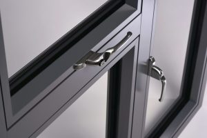 Close up of handles on a black window frame.