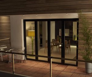 Black framed bi-fold doors on balcony.