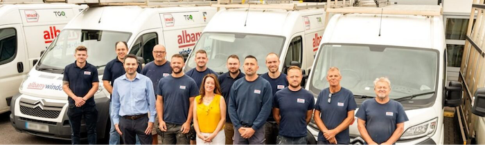 Albany team in front of their vans